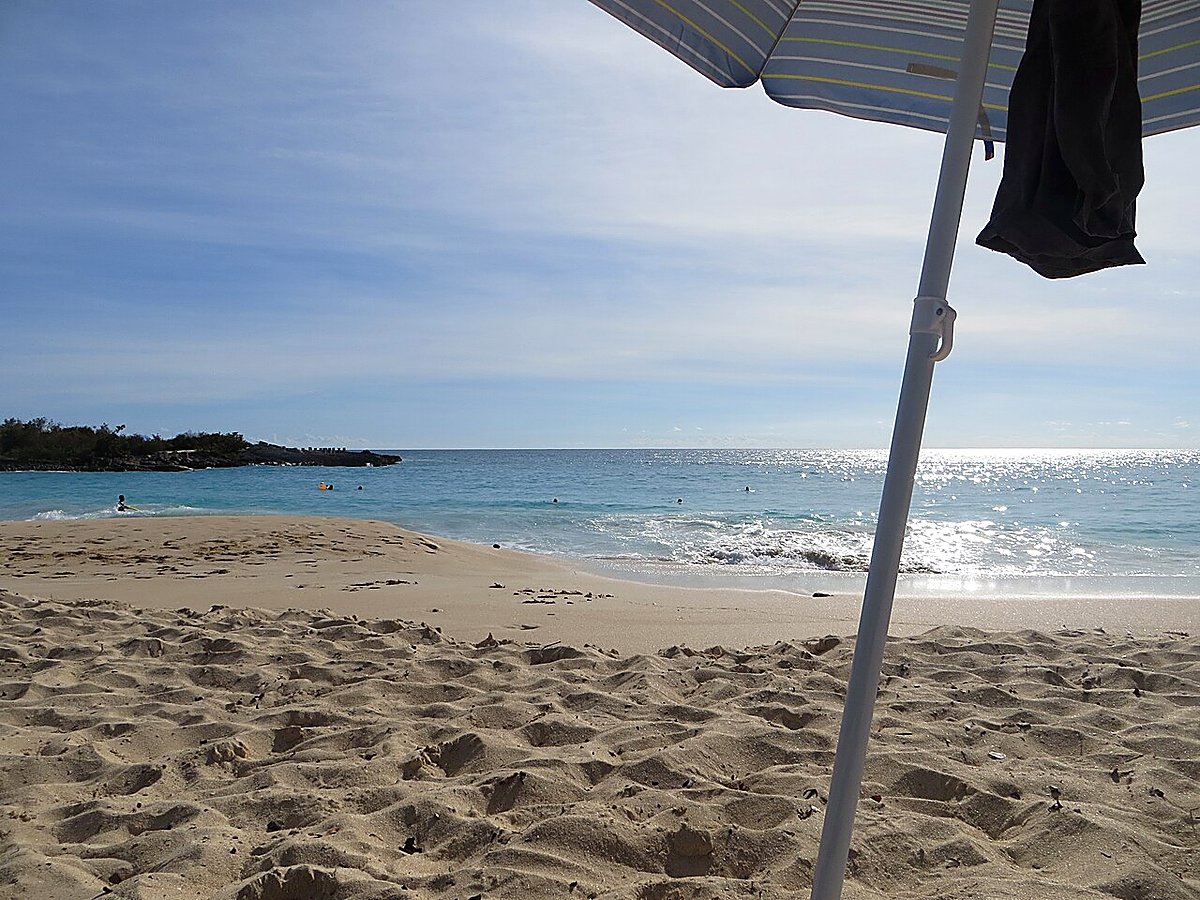 The calm turquoise water and sand of Mullet Bay beach, Sint Maarten