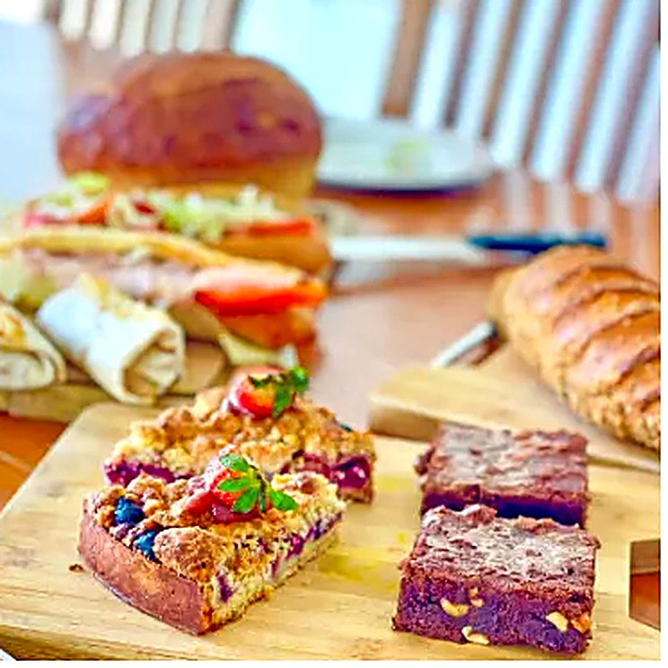 A catering spread of French pastries, tarts and savoury bites prepared by La Sucriere